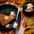 Gourdy - The Jack - O - Lantern Spork set on a Halloween-themed dinner table