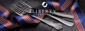3 dinner forks with a red, white and blue ribbon