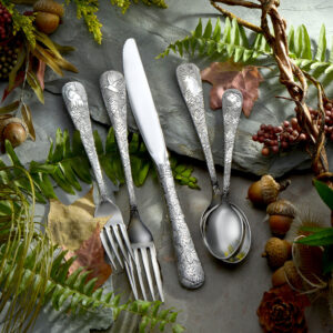 American Outdoors 5pc Flatware Set Glam Shot shown on a decorative table