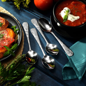 New Owl Flatware spoons shown on a decorative table