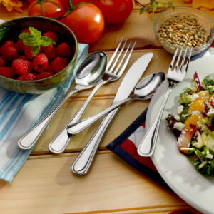 classic rim flatware shown on decorated table