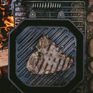 Cast iron grill pan with steak