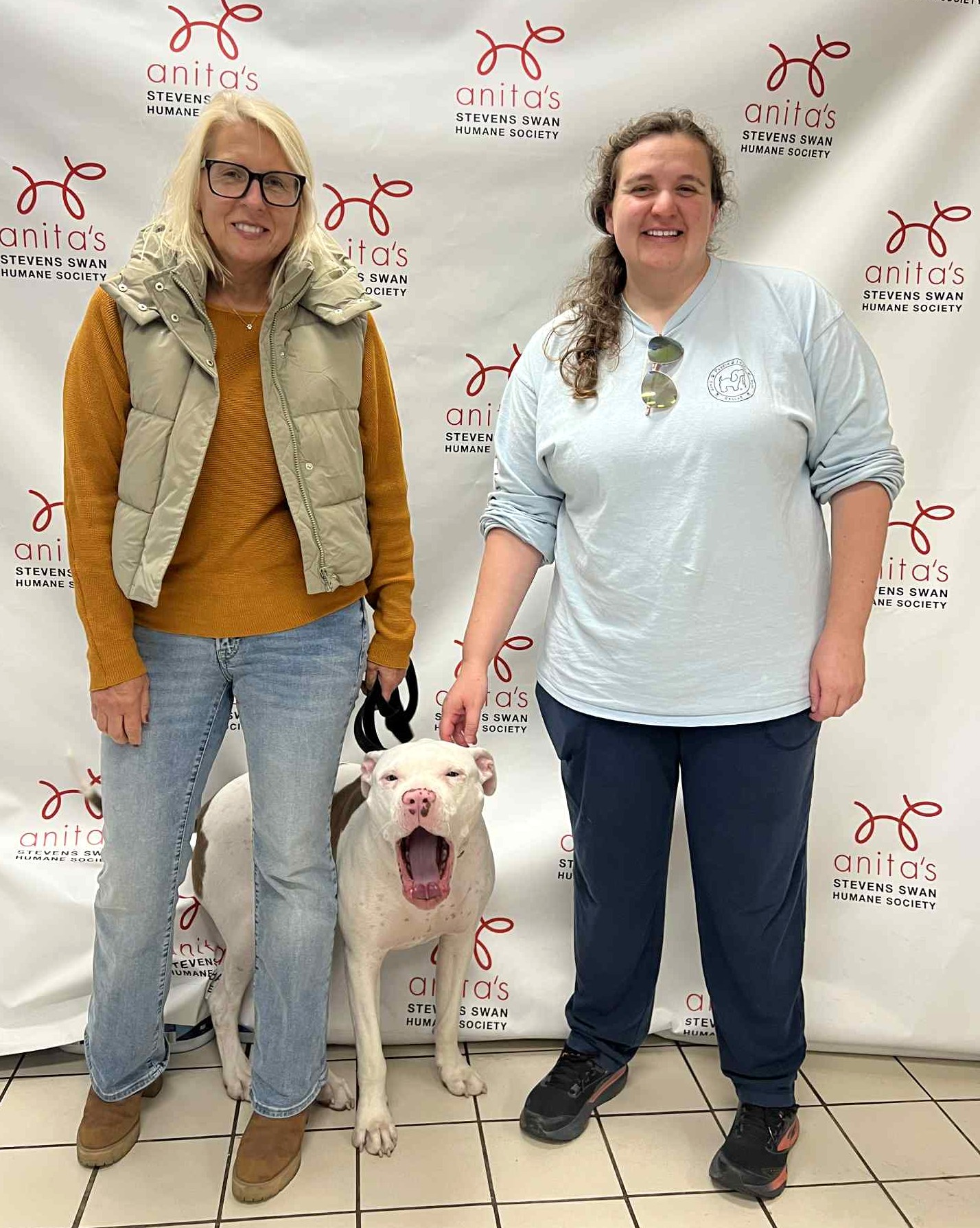 Oliver's Mom Alice Roberts and Anita's Stevens Swan Humane Society Shelter Manager Melissa DeMartino Smile for a selfie with Oliver!